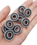 Hand holding several rubber sealed ball bearings 608-2RS 8x22x7mm