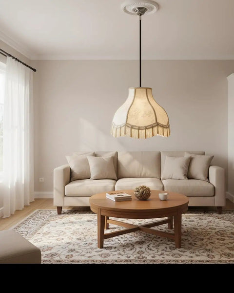 Ivory Jacquard Lamp Shade With Fringes, Scallop Bell Shape on ceiling, living room decor with couch and coffee table.