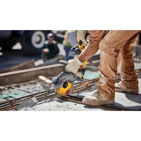 Worker using 9 Inch 5/64 By 7/8 T1 Flexvolt Cutoff Wheel For Metal Cutting on rebar with cordless grinder outdoors