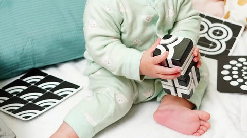 Dope Magnet Building Blocks Kit For Kids Includes Stunt Arena Construction Pieces being played with by a child in pajamas.