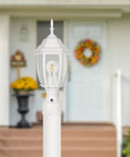 Dusk To Dawn Outdoor Post Light With Pier Mount Base in white, waterproof aluminum lantern head with clear glass panels in garden setting