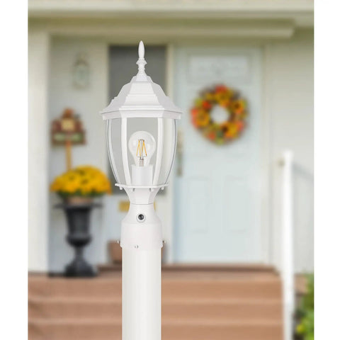 Dusk To Dawn Outdoor Post Light With Pier Mount Base in white, waterproof aluminum lantern head with clear glass panels in garden setting
