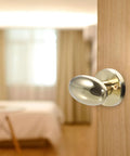 Sleek Concealed Door Handle Featuring Smooth As Butter Swing Dead Nuts Secure Integrated Deadbolt Lock Brushed Stainless Steel Finish For Bedroom Use with a gold finish.