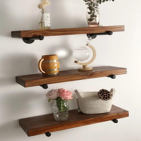 Industrial Iron Pipe Shelf Brackets 8 Inch Floating Shelves Tough As Nails Heavy Duty Metal Brackets For Wood Shelves Supports Up To 120 Lbs Black 6 Pack Easy DIY Industrial Look For Living Room Kitchen showing three shelves with decor items.