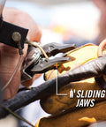 All-In-One Center-Drive Multitool Kit With 16-Piece Tool Set And 12-Piece Bit Set features sliding plier jaws in use with glove