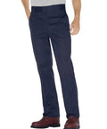 Heavy Duty Straight Leg Work Pants For Men Built Tough For The Daily Grind With A Big And Tall Roomy Fit Durable Polyester Cotton Blend That Shrugs Off Stains And Wrinkles Perfect For Tough Job Sites In Dark Navy shown on model with brown boots.