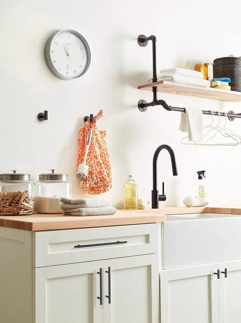 Top Shelf Pro Modern Oil Rubbed Bronze Cabinet And Drawer Pulls Delivering A Fresh Vibe And Solid Grip Perfect For Your Home Decor Update Project And Fast Installation in a kitchen setting with a clock and shelf.