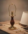 Gold Metal Lamp Stand Bracket Set with Horn Style Mount and Adapters for Table and Floor Lamps alongside tools and fittings.