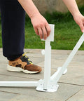 Adjustable Portable Foldable Beach Anchor Base being set up, showing collapsible design, on patio, fits sunshade stand and umbrella