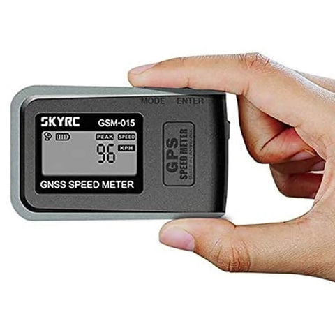 Hand holding GPS Enabled GNSS Remote Control Speedometer And Altimeter Data Tracker, displaying speed reading