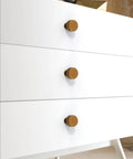 Antique Brass Cabinet Knobs 10 Pack 28mm Round Single Hole Drawer Pulls for Kitchen Cabinets and Furniture shown on white dresser