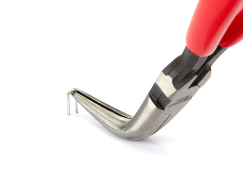 Close-up of 6 Inch 70 Degree Long Nose Pliers With Slim Bent Nose For Tight Obstructions showing gripping action on a small metal object