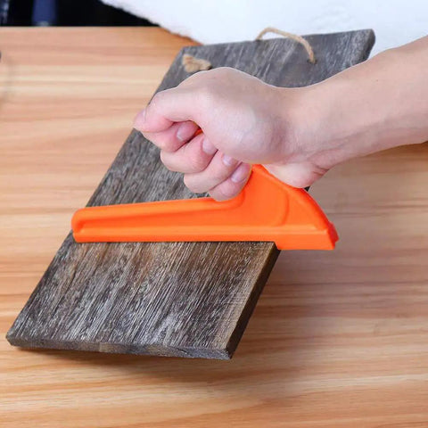 Hand using Bright Orange Safety Push Stick Set For Table Saw And Band Saw Ergonomic Handles 4 Pack on wood board