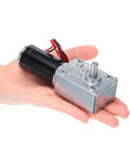 12V High Torque Workhorse Turbine Worm Gear Motor With 8mm Shaft 3 RPM Geared Drive held in hand