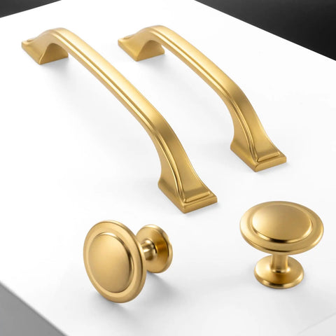 Brushed Gold Cabinet Hardware Three Inch Center To Center Drawer Pulls Ten Pack Heavy Duty Solid Metal kitchen handles on white surface.