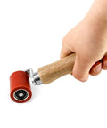 Silicone Seam Roller High Temperature Resistant Heavy Duty Pro Grade Hand Pressure Roller For PVC TPO EPDM Roofing And Vinyl Decking With Ergonomic Wood Handle 40mm Red Heat Resistant Up To 500 Degrees F, held in hand, close-up view.