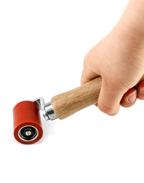 Silicone Seam Roller High Temperature Resistant Heavy Duty Pro Grade Hand Pressure Roller For PVC TPO EPDM Roofing And Vinyl Decking With Ergonomic Wood Handle 40mm Red Heat Resistant Up To 500 Degrees F, held in hand, close-up view.
