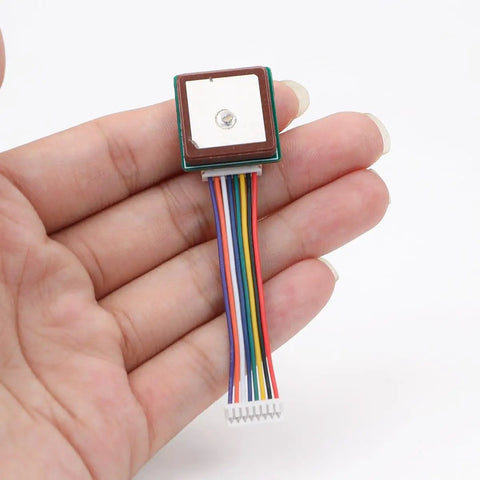 Ultra Low Power GNSS GPS Module For IoT Gear 2.8V To 4.3V, 18mA module held in hand with colored wires