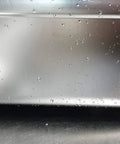 Close-up view of the Stainless Steel Basin Tub Rack for dishwashing and cleaning, showing the rounded rectangle design with water droplets.