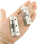 Spring Loaded Hinges For Invisible Doors 304 Stainless Steel Self Closing Hardware shown in hand with 2.5 inch size