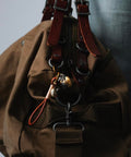 Beating Mechanical Heart Pendant Necklace Steampunk Style Jewelry With Gears And Vascular Details on brown bag