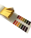 Open PH 1 To 14 Litmus Test Strips Handy Kit Pack Of 10 Includes Color Chart With 80 Pieces Per Pack showing strips and color chart