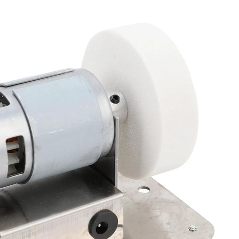 Close-up of Jiawu 100W Mini Bench Grinder With 7-Speed Control And Adjustable Motor showing motor and precision wheel for polishing.