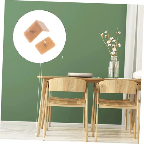 Slick Glide Furniture Slider Pads Two Hundred Pack for Hardwood Floors shown attached to a wooden chair leg to prevent scratches.