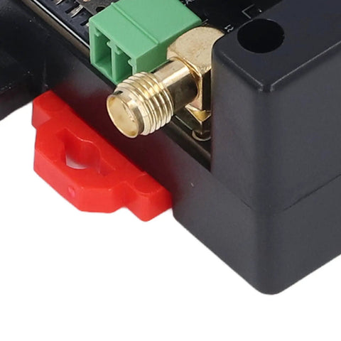 Close-up of GSM Gate Opener Remote Control Access System With Mobile App Management, showing gold connector and ABS casing.