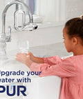 Child using Lead Reducing Faucet Mount Water Filter For Your Sink Easy Install Great Tasting Water Save Money Ditch Bottled Water 100 Gallon Filter Life Chrome Finish Compatible With Sinks With External Aerators.