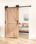 4 To 16 Ft Antique Style Bypass Sliding Wood Barn Door Hardware Kit installed in bedroom, showing black track and rollers