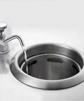 Stainless Steel Brass Dipper Well Faucet for Coffee Shop Sinks in use, showing water flow, ideal for spoon and utensil rinsing.