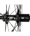 Close-up of Carbon Disc Wheelset Tubeless Ratchet Bike Wheel 700C 50mm Black Fits Shimano with visible 11 Speed hub detail