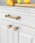 Champagne Bronze Cabinet Pulls 10 Pack With 3.75 Inch Hole Centers Durable Solid Cabinet Handles installed on white kitchen drawers IH0005