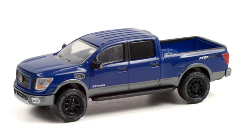 Lifted Blue 1 By 64 Scale Diecast Nissan Titan XD Pro 4X Pickup Truck Model With Real Rubber Tires And Metal Body Chassis Detailed Exterior Collectible Edition