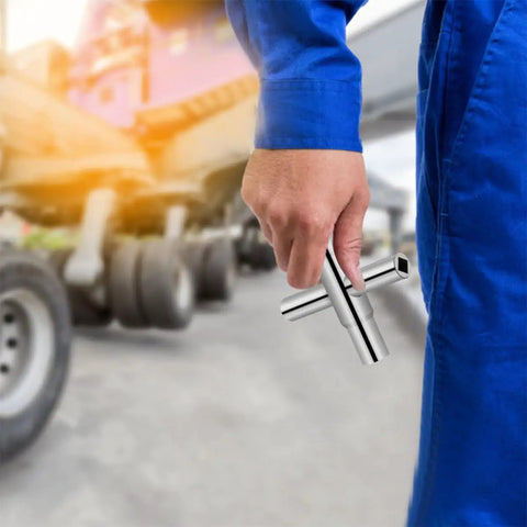 Heavy Duty Folding Socket Wrench Set Featuring Four Precision Cut Openings For Tight Squeezes And Faucet Repair Solid Steel Construction held by a worker.