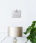 Wall-mounted Economy Millivolt Non Programmable Thermostat White With Simple Temperature Control above a lamp and plant
