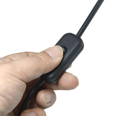 Hand operating the Lamp Switch Kit 250V 6A DPST On Off Rocker Switch For Desk Table Bedroom Lamps Black Two Pack Easy Install Plug And Play