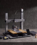 Next Level Rotary Module For Your Desktop Maker Machine featuring CNC engraving setup with wooden base and electronic components.