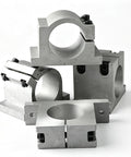 Beefy Aluminum CNC Spindle Mount Bracket With Slick Quick Swap Universal 65Mm Or 80Mm Dual Bore Interface For Router Clamps stacked at various angles.