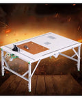 Built Tough Foldable Woodworking Workbench With Thick Plywood Surface And Rust Proof Steel Frame Compact Saw Station For Weekend Warriors and Master Carpenters, showcasing a sturdy setup with a cutting saw.