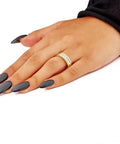 Hella Solid 14K Yellow Gold Wedding Band Ring With One Point Zero Ctw Five Round Diamonds Set In The Real Deal Three Row Stackable Design For Anniversaries worn on hand with dark nails.
