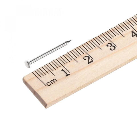 Real Deal Tiny Carbon Steel Nails Nickel Plated Silver Tone Mini Hardware Fasteners For Diy Wood Projects next to a ruler measuring 12mm diameter.