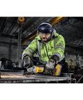 Worker using 20 Volt Brushless Cordless 4 To 5 Inch Angle Grinder Featuring Anti Rotation Safety Shutdown And High Torque Motor Tool Only for steel cutting.