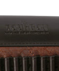 Close-up of the logo on Cheek Rest Pad With 14 Round.22LR Shell Holder For Rifle Stock PU Leather Riser And Extra Cartridge Slot Hunting Gear