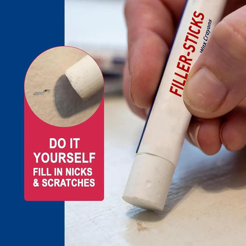 Close-up of a hand using a white wax stick from Five White Wood Repair Wax Sticks Kit For Instant Scratch Fix On Wood Furniture Floors.