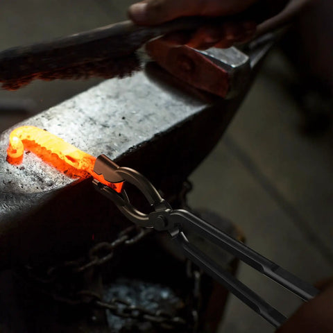 17 Inch Carbon Steel Blacksmith Tongs Set holding hot metal on anvil, demonstrating precise handling in blacksmithing