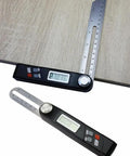 Stainless Steel Digital Angle Finder Protractor With Crisp LCD Display And Dual Measuring Scales Built Tough For Carpentry Or Metal Fabrication Guarantees Dead On Angles Every Time measuring angles on wood surface.