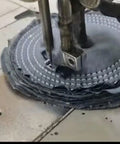 Close-up of Denim Buffing Wheel For Bench Grinder And Die Grinder, Six Inch By One Inch Thick With Half Inch Arbor being cut.