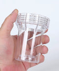 Person holding clear plastic component of Inline Garden Hose Water Filter For Well Water With 100 Mesh Screen Sediment Filter Attachment